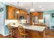 Stylish kitchen featuring granite countertops, stainless steel appliances, and a functional island with bar stool seating at 3953 Lorien Nw Way, Kennesaw, GA 30152