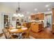 Bright kitchen with a breakfast nook, granite countertops, stainless steel appliances, and hardwood floors at 3953 Lorien Nw Way, Kennesaw, GA 30152