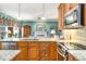 Well-appointed kitchen featuring granite countertops, modern appliances, and a seamless transition into the adjacent living area at 3953 Lorien Nw Way, Kennesaw, GA 30152