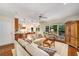 Cozy living room with hardwood floors, comfortable sofas, and a view into the kitchen and dining area at 3953 Lorien Nw Way, Kennesaw, GA 30152