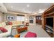 Basement living room with comfortable seating, fireplace and a bar just off the room at 3953 Lorien Nw Way, Kennesaw, GA 30152