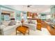 Open-concept living space with seamless flow to kitchen area, featuring comfortable seating and stylish decor at 3953 Lorien Nw Way, Kennesaw, GA 30152