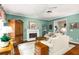 Elegant living room boasts hardwood floors, a fireplace, and comfortable seating, creating a welcoming and stylish atmosphere at 3953 Lorien Nw Way, Kennesaw, GA 30152