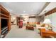 Cozy basement living room with a comfortable sectional sofa and entertainment center at 3953 Lorien Nw Way, Kennesaw, GA 30152