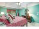 Bright main bedroom featuring a four-poster bed and large window with decorative valance at 3953 Lorien Nw Way, Kennesaw, GA 30152