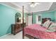 Spacious main bedroom with a four-poster bed, dresser, and tray ceiling at 3953 Lorien Nw Way, Kennesaw, GA 30152