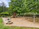 Community playground featuring swings, a slide, and picnic tables for Gathering fun at 3953 Lorien Nw Way, Kennesaw, GA 30152
