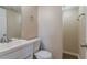 Bathroom features a modern vanity, toilet, framed mirror, and enclosed shower with tiled walls at 4016 Nations Dr, Douglasville, GA 30135