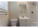 Bathroom featuring a white vanity, toilet, shower and neutral paint and trim at 4016 Nations Dr, Douglasville, GA 30135