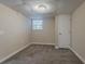 Bedroom with plush carpet, a window for natural light, and a closet for storage at 4016 Nations Dr, Douglasville, GA 30135