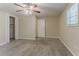 Bedroom with carpet, a ceiling fan and a walk-in closet with an open door at 4016 Nations Dr, Douglasville, GA 30135