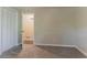 Bedroom featuring a closet with open door and neutral walls with trim and carpet at 4016 Nations Dr, Douglasville, GA 30135