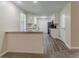 Well-lit kitchen with stylish countertops and wood flooring, seamlessly flowing into the living space at 4016 Nations Dr, Douglasville, GA 30135