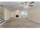 Large living area featuring plush carpeting, a fireplace, and staircase at 4016 Nations Dr, Douglasville, GA 30135