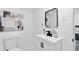 Modern bathroom has a sleek vanity, matte black fixtures, and stylish mirror at 1386 Pineglen Dr, Riverdale, GA 30296