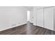 Bedroom showcasing hardwood floors, white walls, and a large closet with sliding doors at 1386 Pineglen Dr, Riverdale, GA 30296