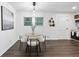 Cozy dining area featuring modern decor, natural light, and dark wood floors at 1386 Pineglen Dr, Riverdale, GA 30296