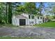 White two-story home with attached garage and a well-manicured front lawn at 1386 Pineglen Dr, Riverdale, GA 30296