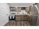 Modern kitchen showcasing stainless steel appliances and dark wood cabinets at 1386 Pineglen Dr, Riverdale, GA 30296