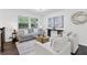 Bright living room featuring a comfortable seating arrangement and modern decor at 1386 Pineglen Dr, Riverdale, GA 30296