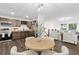 Open concept living area connecting the kitchen, dining, and living spaces at 1386 Pineglen Dr, Riverdale, GA 30296