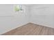 A versatile room featuring wood floors, shelving, and a bright window at 1386 Pineglen Dr, Riverdale, GA 30296