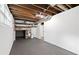 Unfinished room features open beam ceiling and useful shelving at 1386 Pineglen Dr, Riverdale, GA 30296