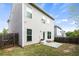 Backyard with a concrete patio, well maintained lawn, and wood fence at 1749 Charcoal Ives Rd, Lawrenceville, GA 30045