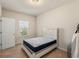 Bedroom featuring a bed and a large window at 1749 Charcoal Ives Rd, Lawrenceville, GA 30045