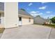 Back of home featuring a concrete patio area and a backyard with grass at 1835 Patrick Mill, Buford, GA 30518