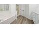 Relaxing bathroom featuring a soaking tub and separate shower at 1835 Patrick Mill, Buford, GA 30518