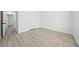 Bedroom features stylish light wood flooring, neutral white walls, and a hallway view at 1835 Patrick Mill, Buford, GA 30518