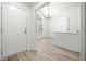 Bright foyer with hardwood floors and white trim leading into a dining area, showcasing its inviting and fresh interior at 1835 Patrick Mill, Buford, GA 30518