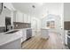 Bright kitchen features white cabinetry, stainless appliances, center island, and stylish backsplash at 1835 Patrick Mill, Buford, GA 30518