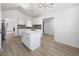 Spacious and modern kitchen featuring a center island, white cabinets, and stainless steel appliances perfect for cooking at 1835 Patrick Mill, Buford, GA 30518