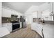 Bright kitchen with white cabinets, granite countertops, stainless steel appliances, and a stylish tile backsplash at 1835 Patrick Mill, Buford, GA 30518