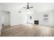 Inviting living room with fireplace, ceiling fan, and ample natural light at 1835 Patrick Mill, Buford, GA 30518