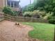 Fenced backyard with lush greenery and a multi-tiered deck offering views of the surrounding nature at 2667 Hampton Park Dr, Marietta, GA 30062