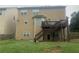 Two-story home with a deck and stairs, situated in a large backyard with a wooden fence at 2667 Hampton Park Dr, Marietta, GA 30062