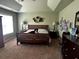 Spacious main bedroom showcasing trey ceilings, carpeted floors, and plenty of natural light at 2667 Hampton Park Dr, Marietta, GA 30062