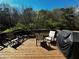 Outdoor deck with patio furniture and views of the surrounding woods at 2667 Hampton Park Dr, Marietta, GA 30062