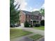 Brick home with a long driveway and attached garage, surrounded by green trees at 2667 Hampton Park Dr, Marietta, GA 30062
