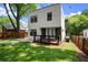 The backyard has a modern deck, green lawn, and is bordered by a wooden fence, offering a private outdoor space at 32 Wadley Nw St, Atlanta, GA 30314