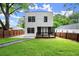 A home with a spacious, green backyard featuring a modern deck and well-maintained lawn at 32 Wadley Nw St, Atlanta, GA 30314
