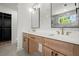 Elegant bathroom featuring double vanity sinks, designer mirrors, and modern finishes at 32 Wadley Nw St, Atlanta, GA 30314