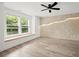 Bright and airy bedroom featuring a decorative accent wall and large windows at 32 Wadley Nw St, Atlanta, GA 30314