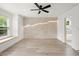 Bright and airy bedroom featuring a decorative accent wall and large windows at 32 Wadley Nw St, Atlanta, GA 30314