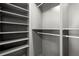 Spacious walk-in closet with custom shelving and ample storage space at 32 Wadley Nw St, Atlanta, GA 30314