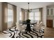 Elegant dining room with modern chandelier, neutral colors, and large windows for natural light at 32 Wadley Nw St, Atlanta, GA 30314