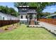 Charming home with a well-manicured lawn, wooden fence, and a modern exterior at 32 Wadley Nw St, Atlanta, GA 30314